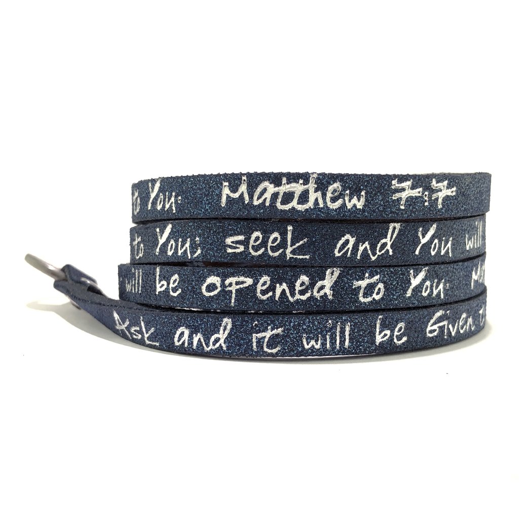 Stardust Navy Bible Verse Wrap Around bracelet featuring Matthew 7:7, made of leather with a custom buckle.