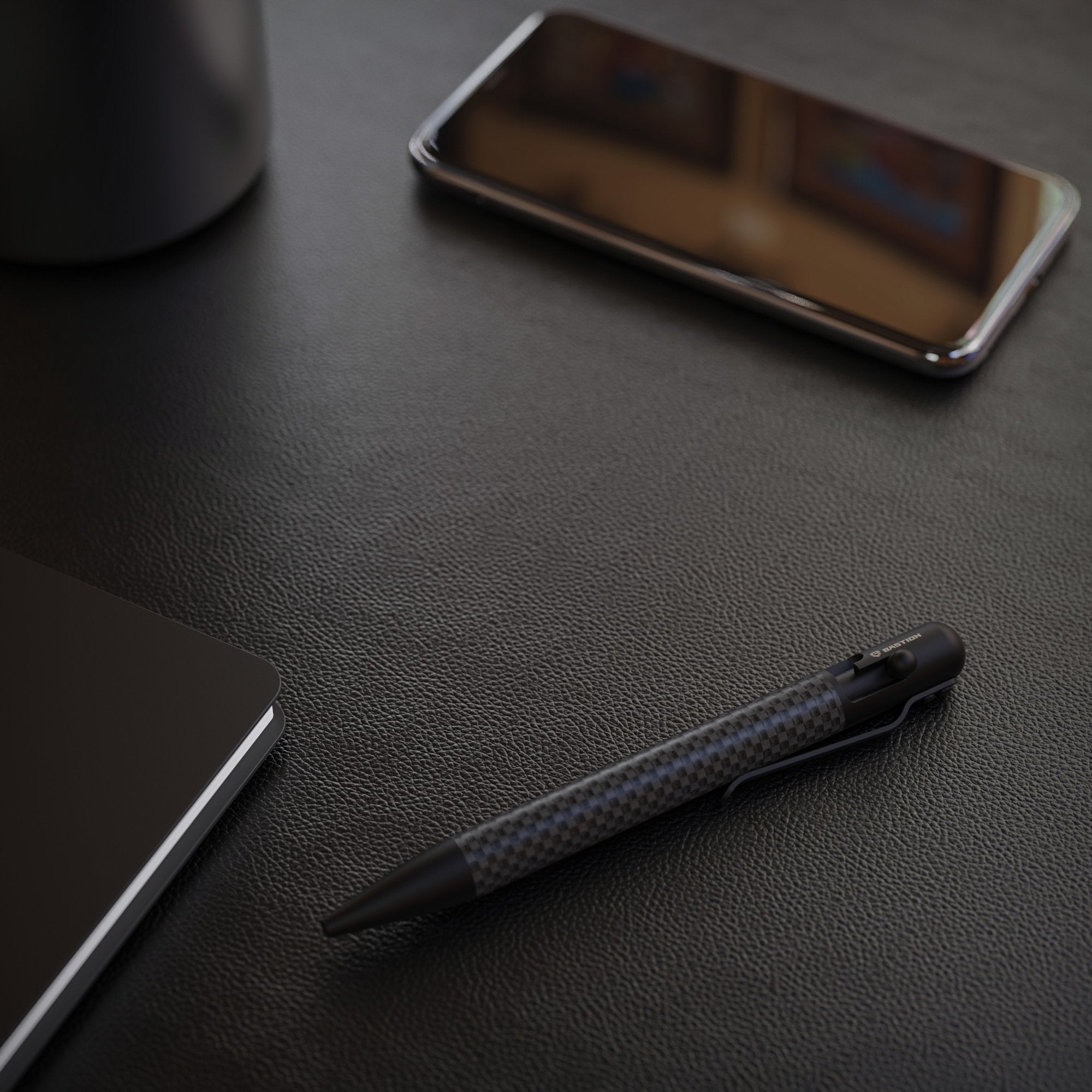 Carbon Fiber and Stainless Steel Bolt Action Pen by Bastion, showcasing its sleek design and premium materials.