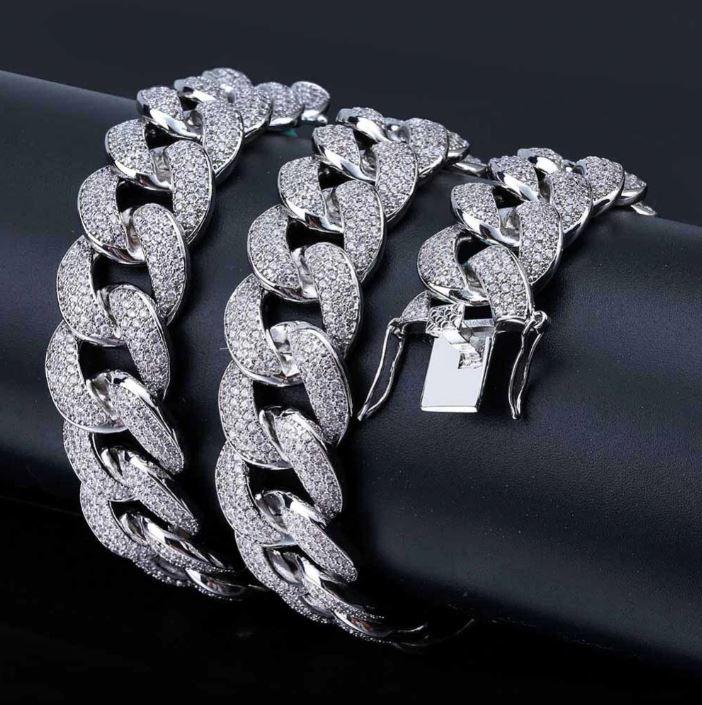 COLT 12MM Cuban Chain featuring luxurious Cubic Zirconia stones on brass copper metal, showcasing a bold and elegant design.