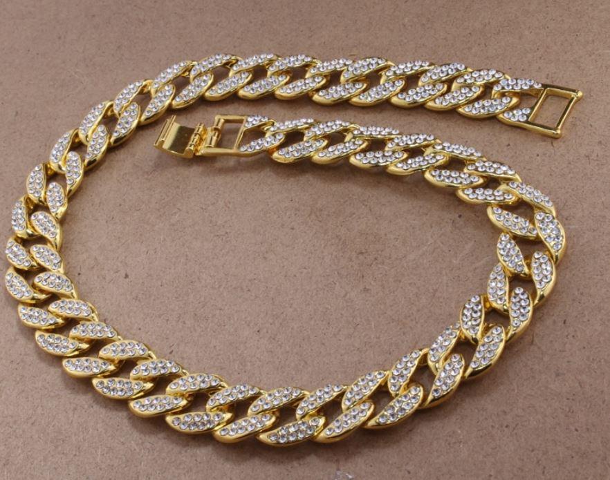 CREW BM 13 MM Cuban Chain featuring rhinestone crystals, solid brass material, and a fold-over clasp, showcasing its intricate design and bold thickness.