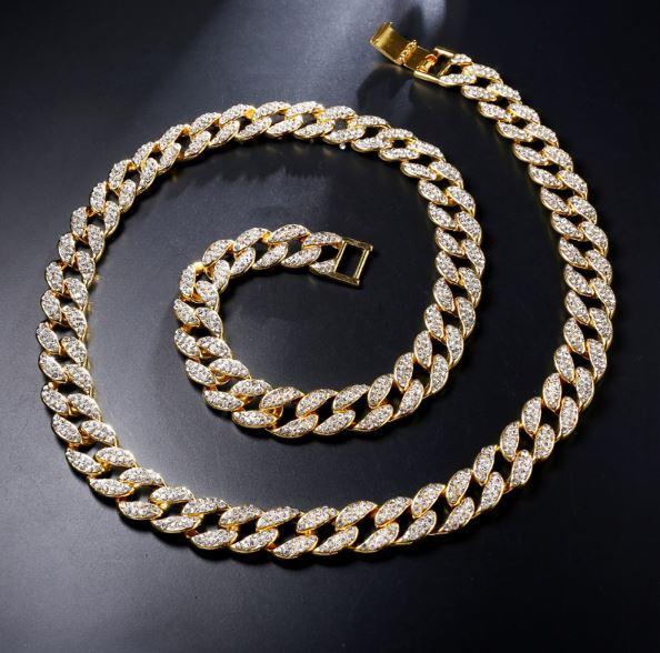 CREW BM 13 MM Cuban Chain featuring rhinestone crystals, solid brass material, and a fold-over clasp, showcasing its intricate design and bold thickness.