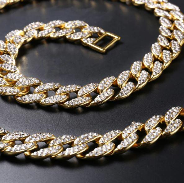 CREW BM 13 MM Cuban Chain featuring rhinestone crystals, solid brass material, and a fold-over clasp, showcasing its intricate design and bold thickness.