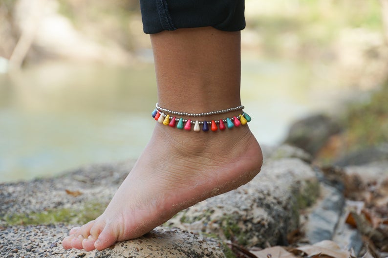 Fancy Teardrop Bead Boho Silver Anklet featuring silver bells and pressed cotton chords, handcrafted by Thai artisans.