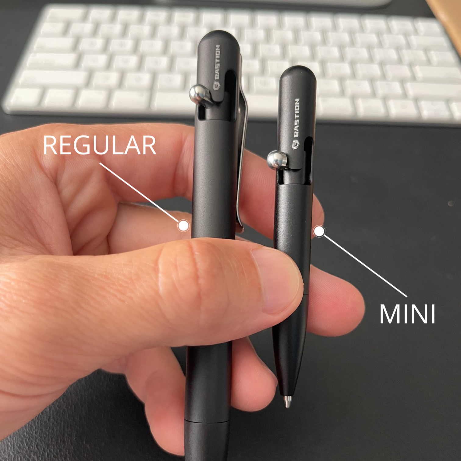 Mini Clipless Bolt Action Pen by Bastion® in sleek aluminum design, showcasing its compact size and ergonomic grip.