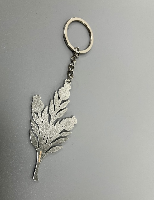 A detailed Pomegranate Branch Keychain made of silver-coated copper, featuring an elegant design of pomegranate branches and fruits.