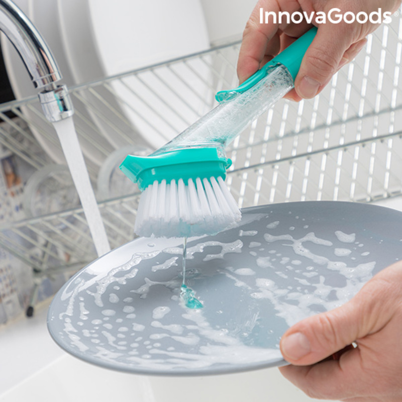 Washing dish with soap brush.