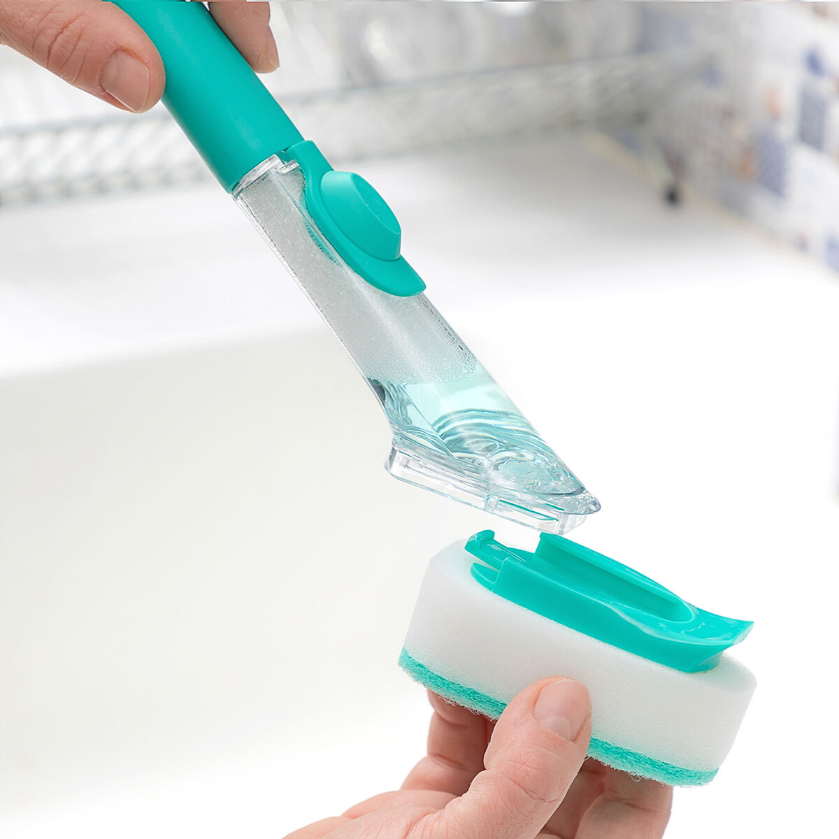 Dish soap dispensing scrub brush.