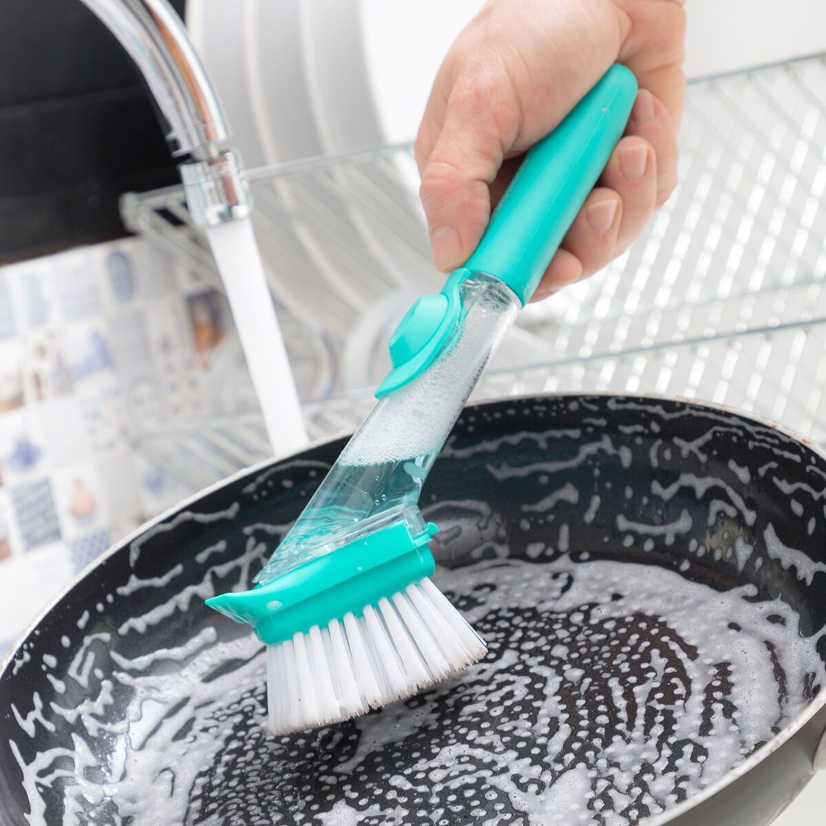 Washing pan with soap brush.