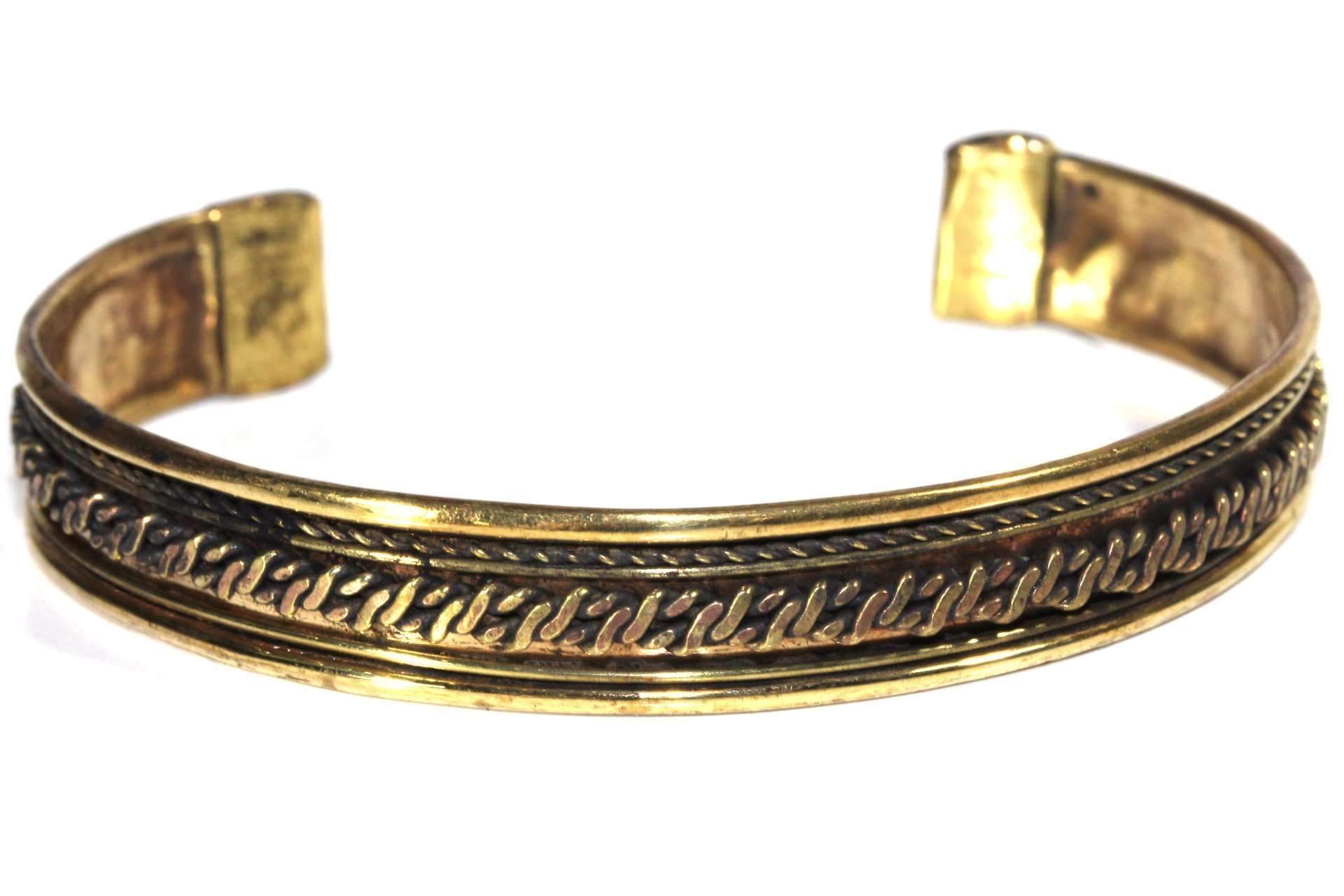 A beautifully crafted Tribal Cuff Bangle in bronze and brass tones featuring intricate handmade scroll work designs, adjustable for a perfect fit.