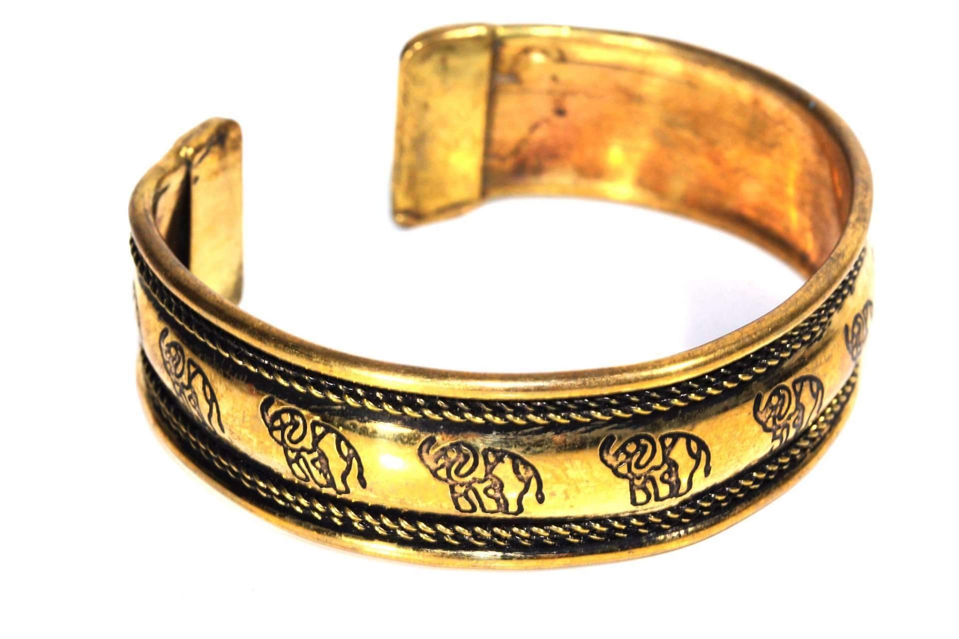 A beautifully crafted Tribal Cuff Bangle in bronze and brass tones featuring intricate handmade scroll work designs, adjustable for a perfect fit.