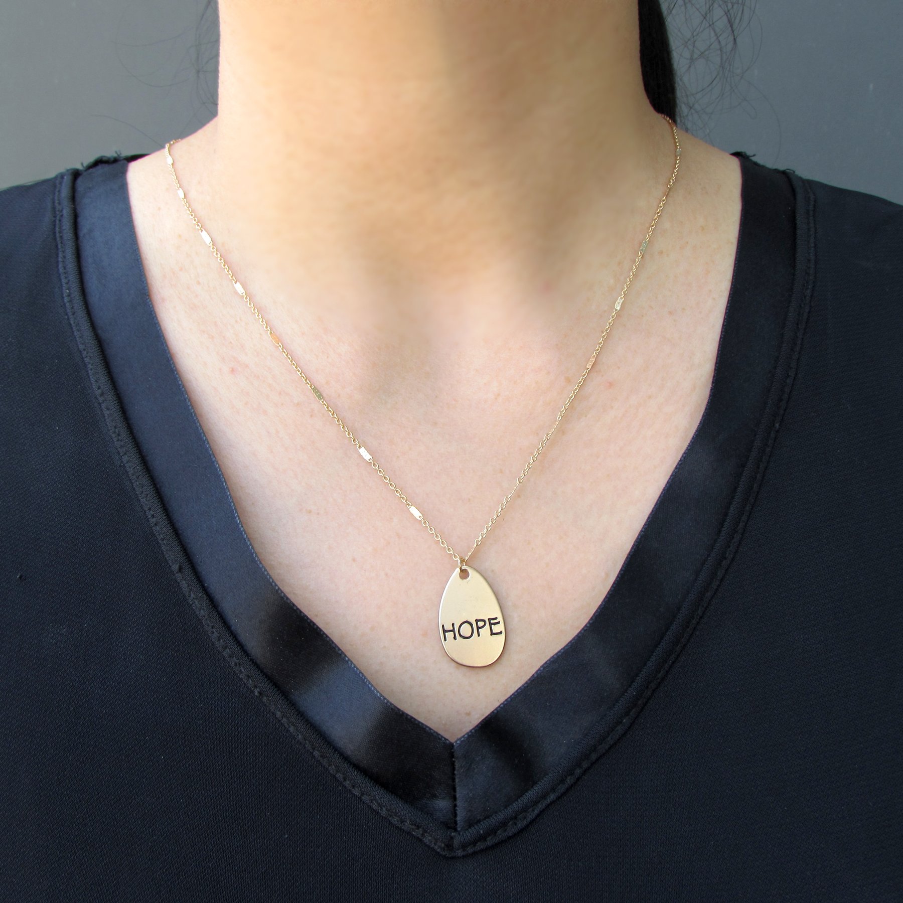 Trust Necklace featuring double-sided design with 'Hope' and 'Faith' inscriptions, alloy plated in silver and gold.