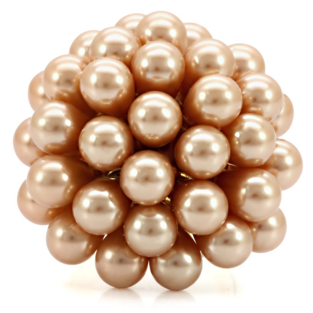 Elegant gold brass ring featuring a champagne synthetic pearl, showcasing its luxurious design and craftsmanship.