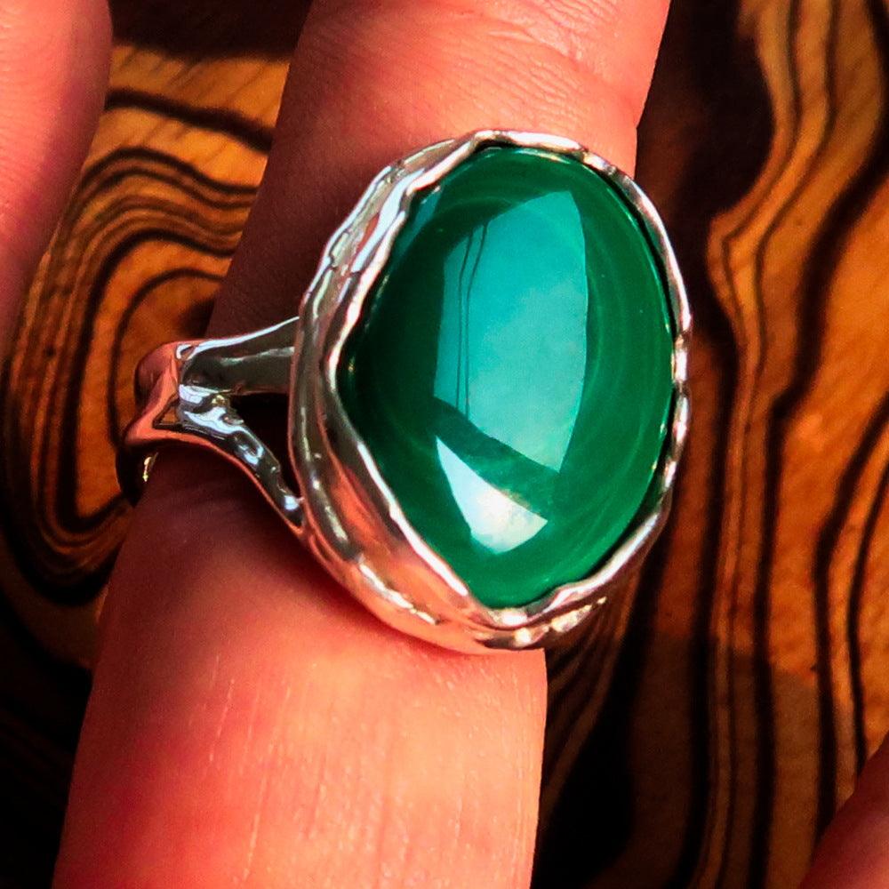 Sterling Silver Ring featuring an oval Green Malachite gemstone, size 10.5, polished finish.