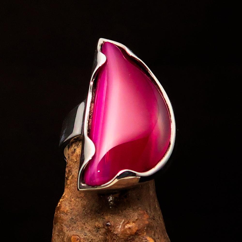 Asymmetric Sterling Silver Ring featuring a fancy shaped pink Agate Cabochon, showcasing its unique design and polished finish.