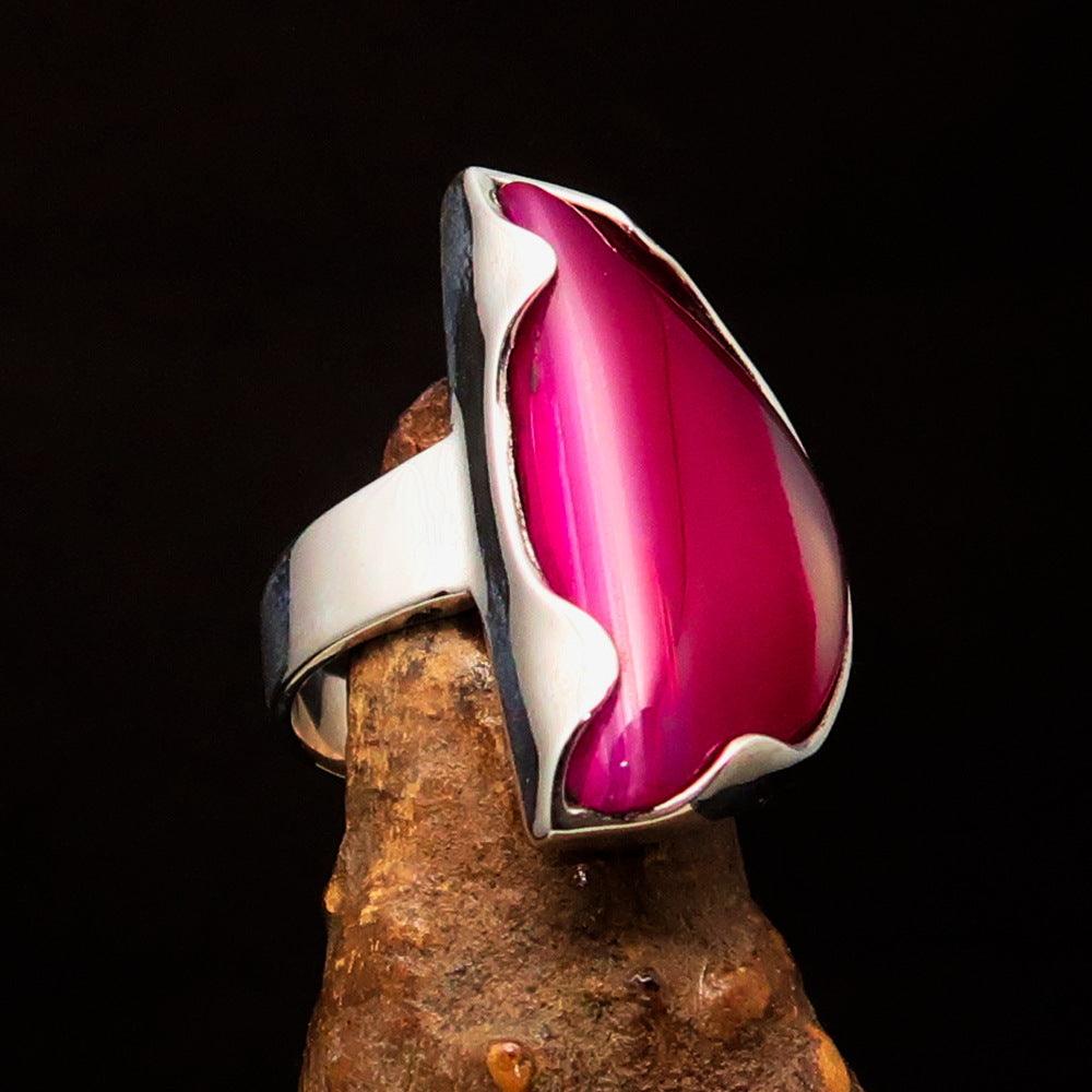 Asymmetric Sterling Silver Ring featuring a fancy shaped pink Agate Cabochon, showcasing its unique design and polished finish.