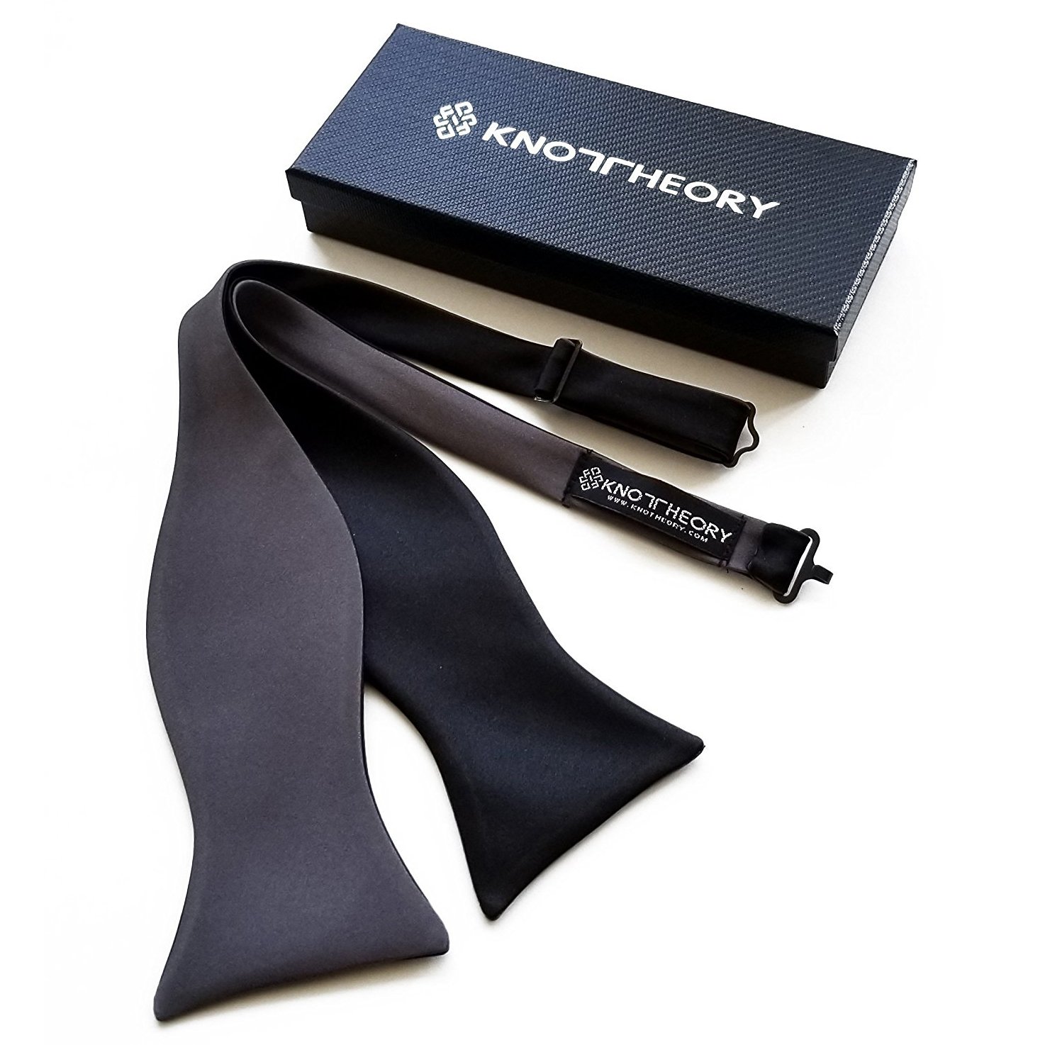 A sophisticated black and slate grey reversible butterfly bow tie, showcasing its elegant design and versatility.