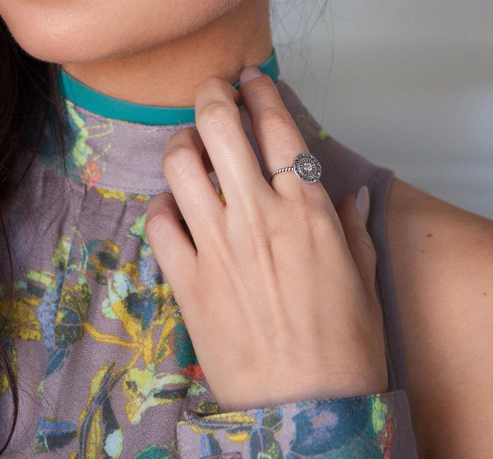 A stunning Bohemian Glam Ring made of oxidized Sterling Silver featuring a sparkling 3mm Swarovski crystal on top, elegantly displayed in a KP pink jewelry box.