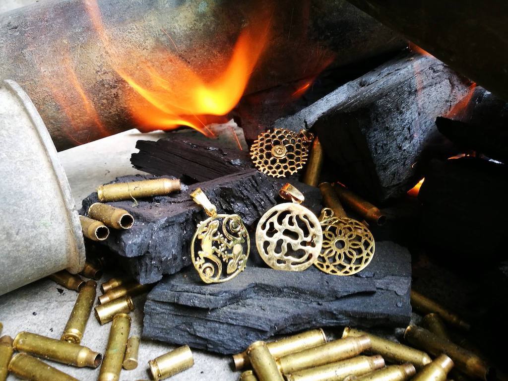 Bullet casings and metal pendants.