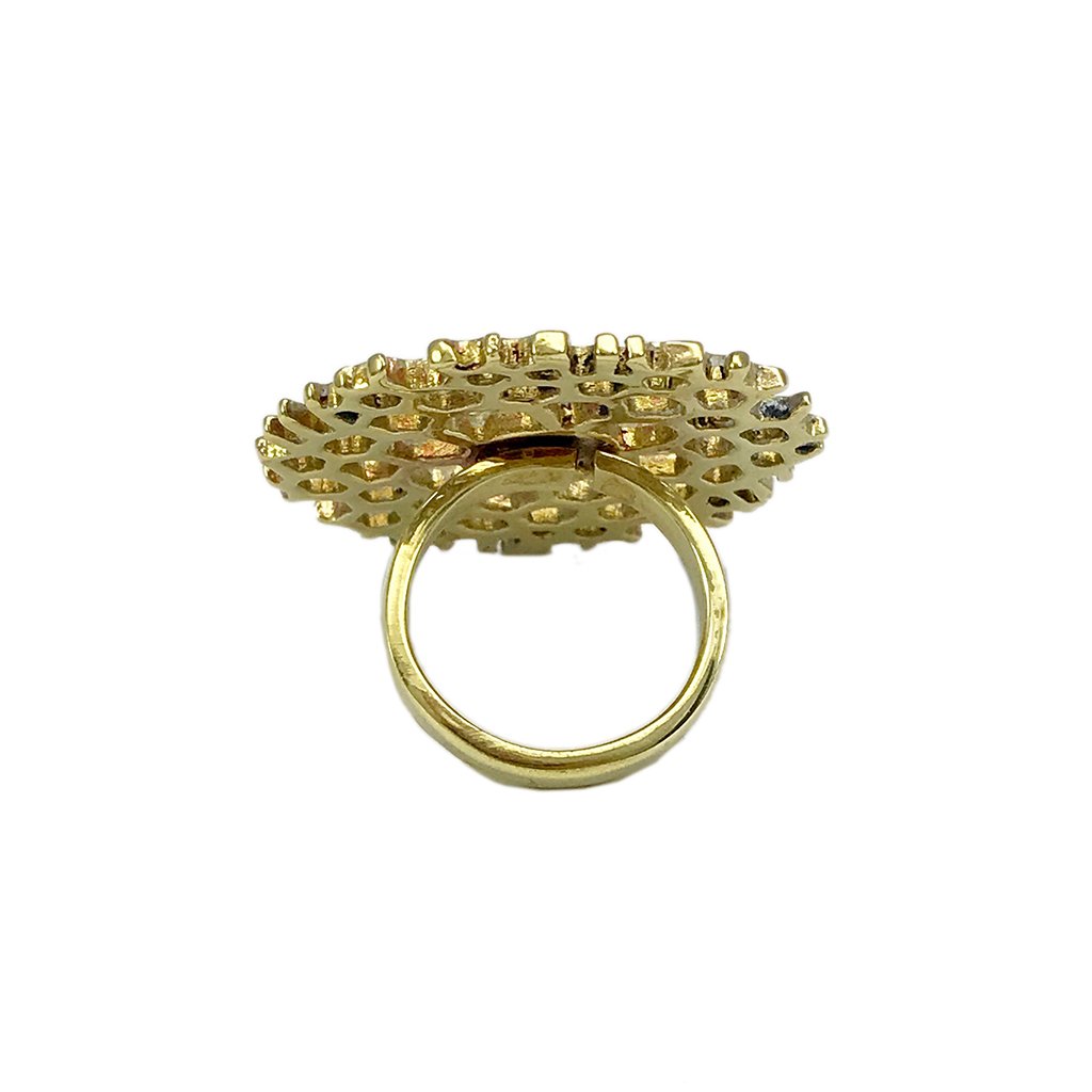 Golden ring with intricate design.