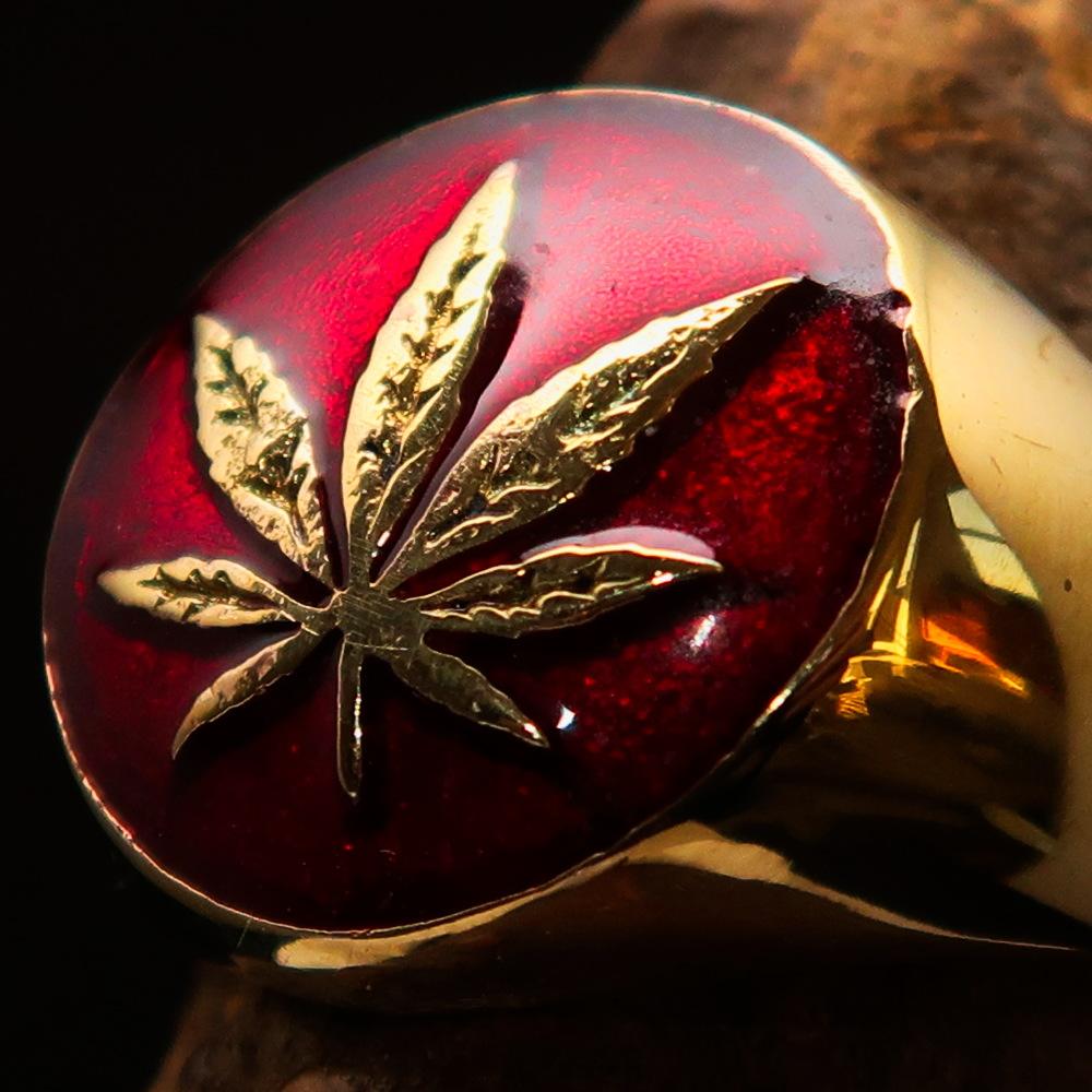 Brass Marihuana Leaf Men's Ring featuring a high-polished finish and vibrant red enamel, showcasing a unique leaf design.