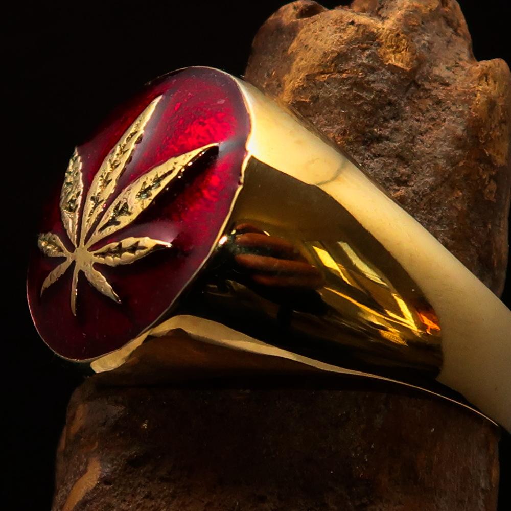 Brass Marihuana Leaf Men's Ring featuring a high-polished finish and vibrant red enamel, showcasing a unique leaf design.