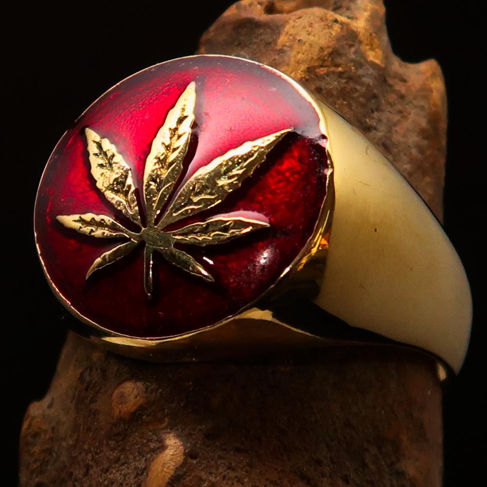 Brass Marihuana Leaf Men's Ring featuring a high-polished finish and vibrant red enamel, showcasing a unique leaf design.