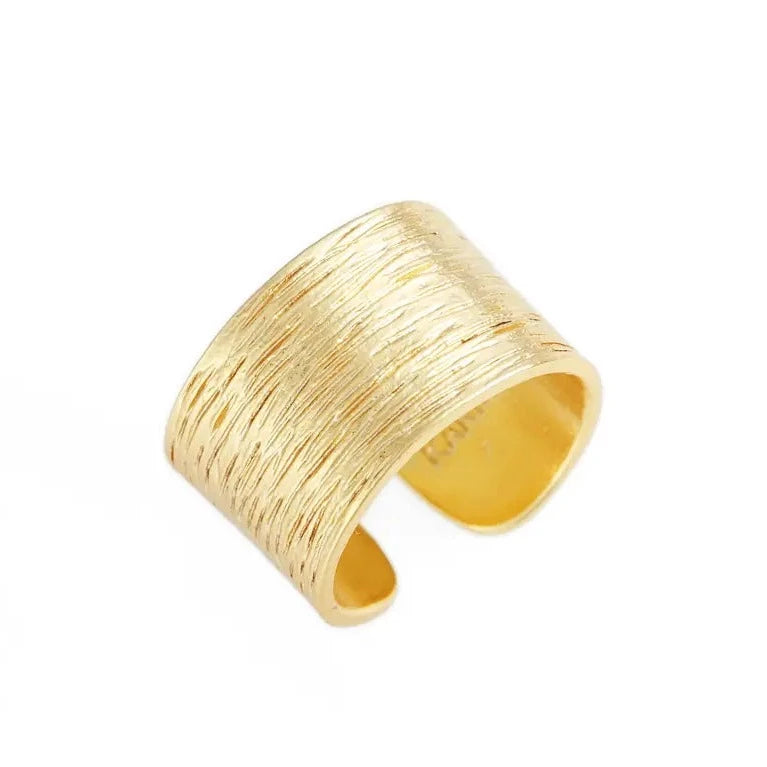 A simple brushed warm gold ring with a minimalist design, slightly adjustable to fit most fingers, showcasing its elegant texture and finish.