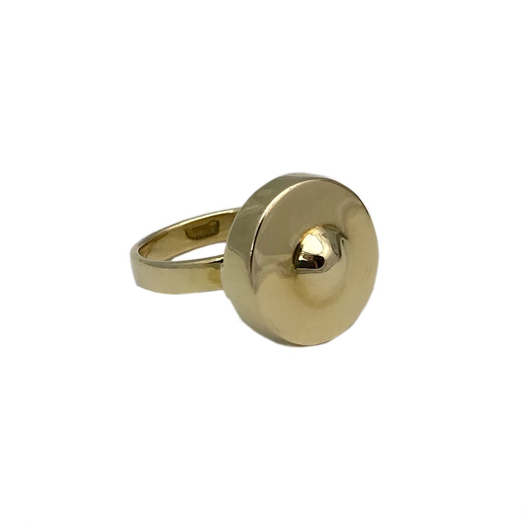 A beautifully crafted Cambodian Gong Ring made from recycled brass bombshells, showcasing its unique gong shape and polished finish.