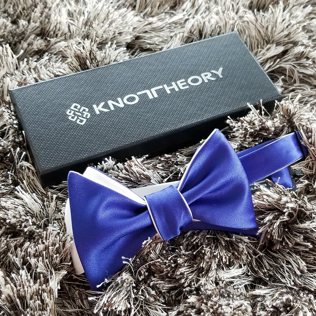 A stylish custom bow tie showcasing various wing tip styles and color options, perfect for personalized fashion.