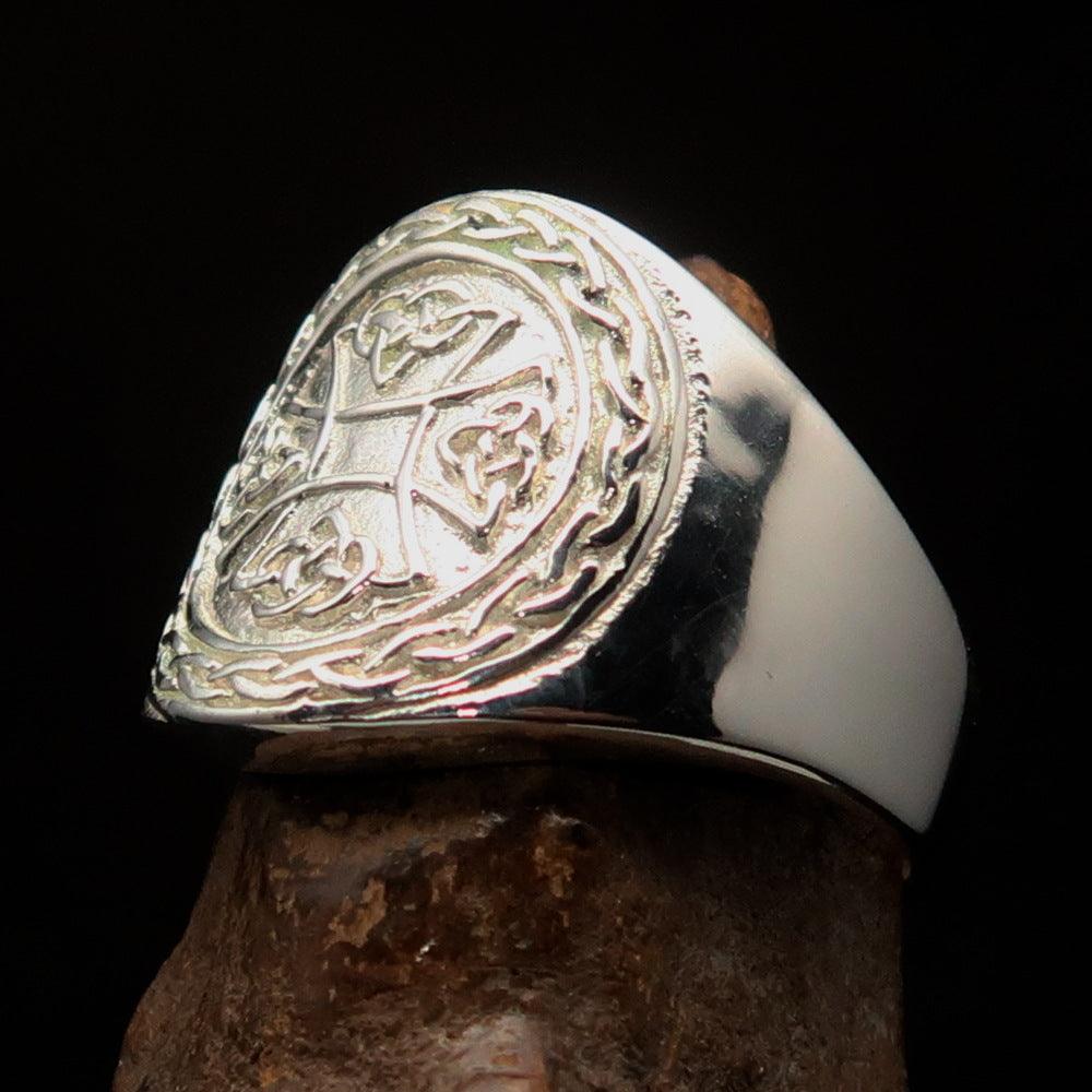 A beautifully crafted sterling silver Celtic Birgit's Cross Ring with a mirror polished finish, showcasing intricate designs.