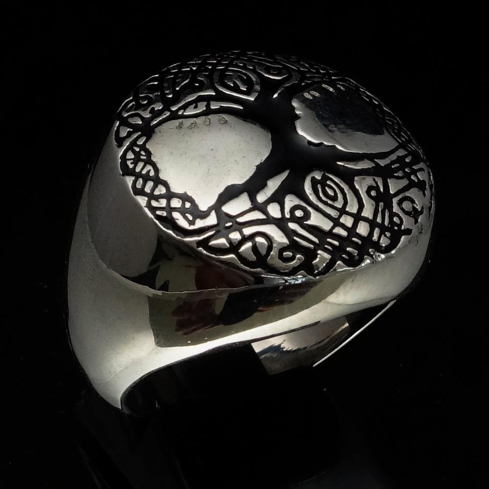 Men's black Tree of Life Ring made of solid sterling silver with high polish and enamel detailing, showcasing intricate design.