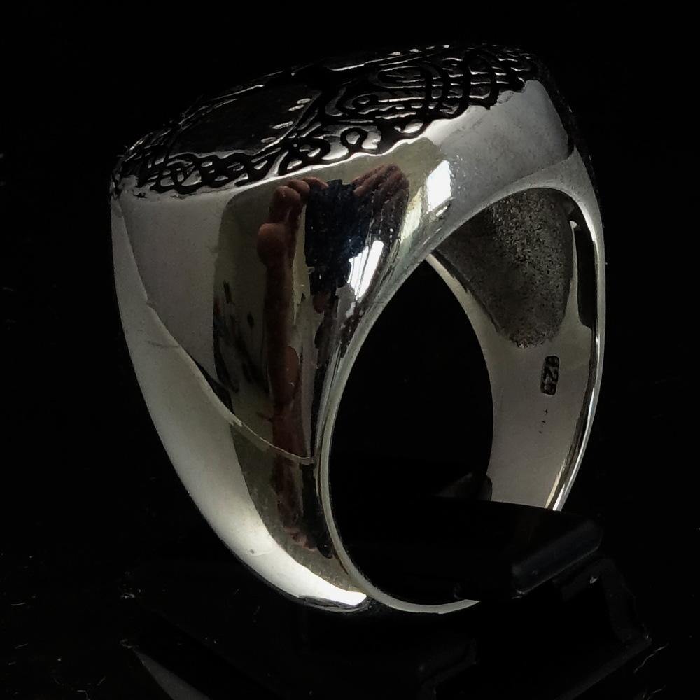 Men's black Tree of Life Ring made of solid sterling silver with high polish and enamel detailing, showcasing intricate design.