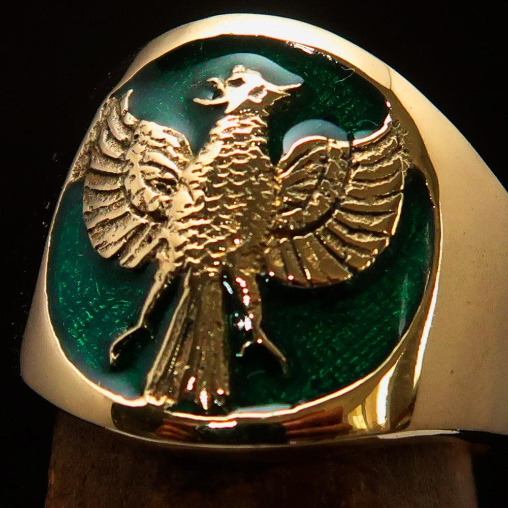 Men's green Garuda Ring made of solid brass with intricate design and green enamel detailing.