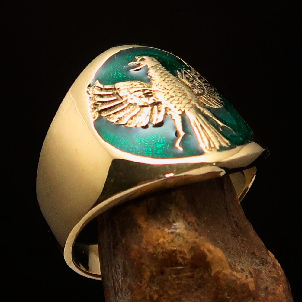 Men's green Garuda Ring made of solid brass with intricate design and green enamel detailing.