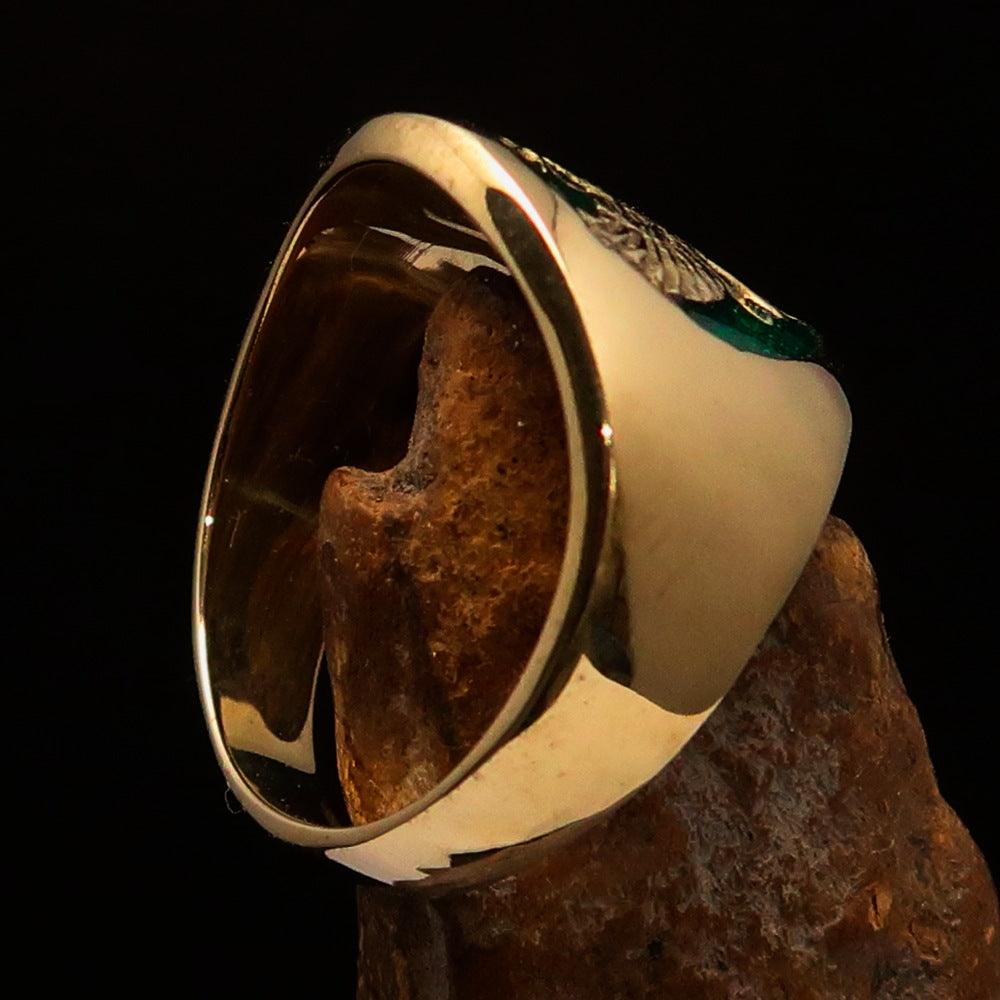 Men's green Garuda Ring made of solid brass with intricate design and green enamel detailing.