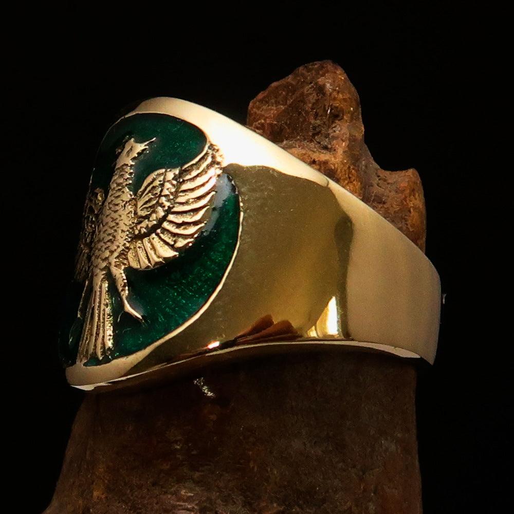 Men's green Garuda Ring made of solid brass with intricate design and green enamel detailing.