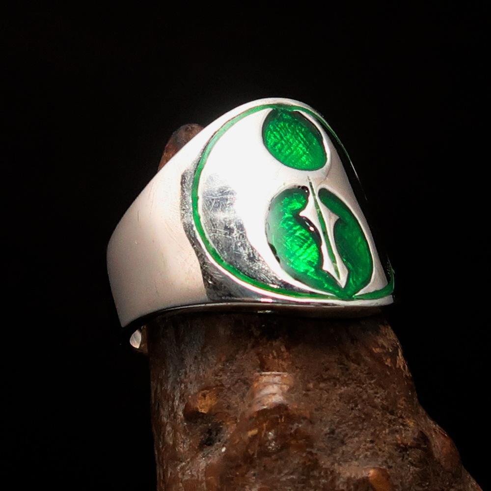 Men's green Labrys double Axe Ring made of solid sterling silver with high polish and enamel finish, showcasing intricate design.