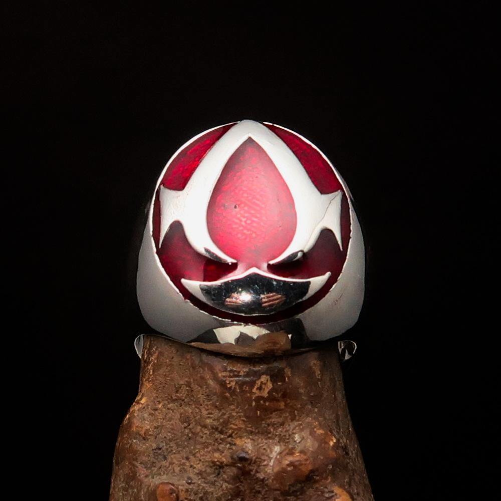 Men's red Assassin Ring made of solid Sterling Silver with high polish and vibrant red enamel finish, showcasing its intricate design.