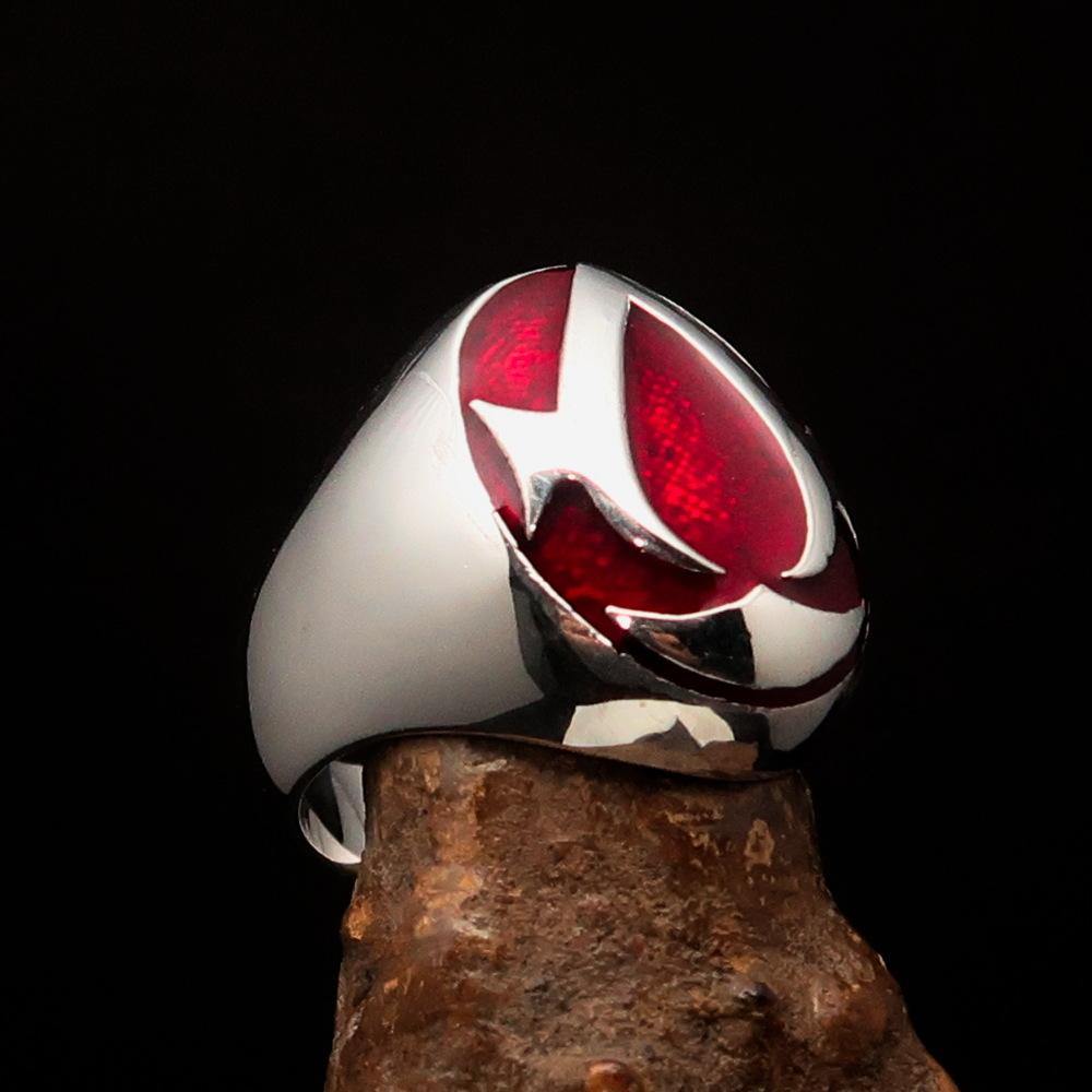 Men's red Assassin Ring made of solid Sterling Silver with high polish and vibrant red enamel finish, showcasing its intricate design.