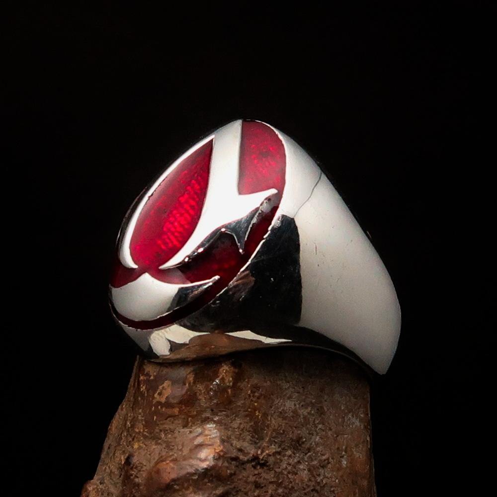 Men's red Assassin Ring made of solid Sterling Silver with high polish and vibrant red enamel finish, showcasing its intricate design.