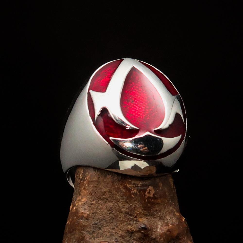 Men's red Assassin Ring made of solid Sterling Silver with high polish and vibrant red enamel finish, showcasing its intricate design.