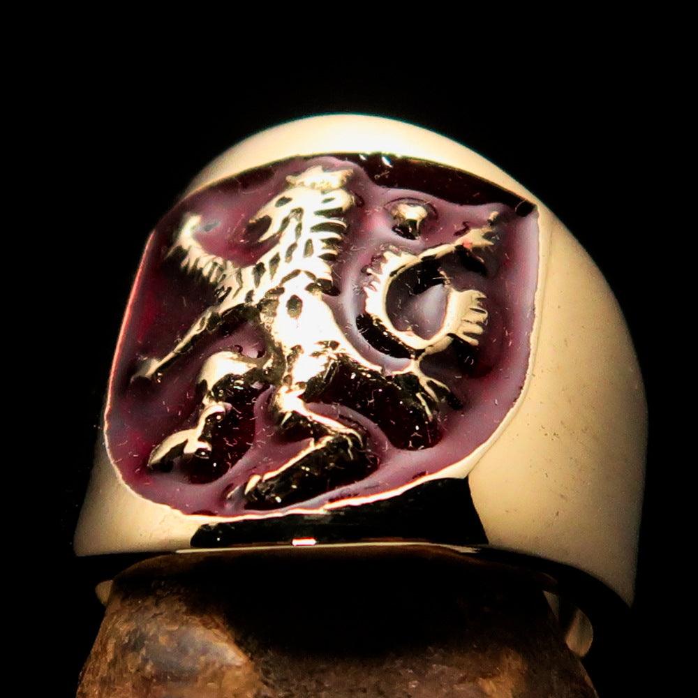 A beautifully crafted ancient men's ring featuring a red enamel rampant lion design, made from solid brass with a polished finish.