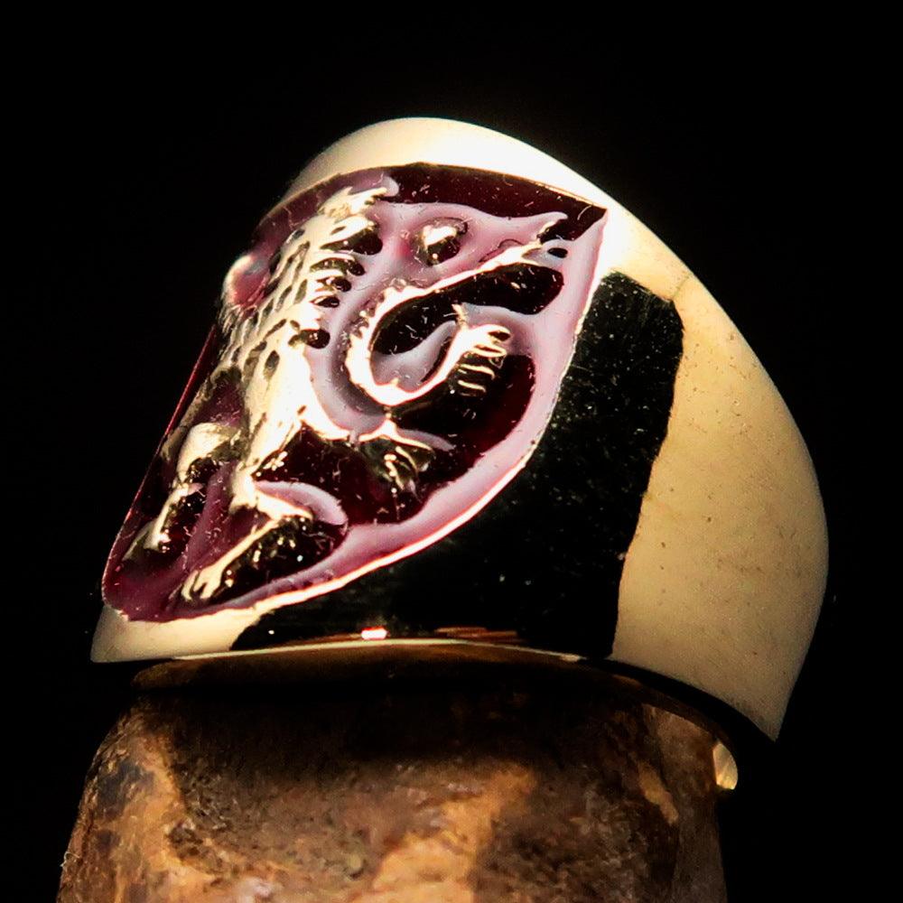 A beautifully crafted ancient men's ring featuring a red enamel rampant lion design, made from solid brass with a polished finish.