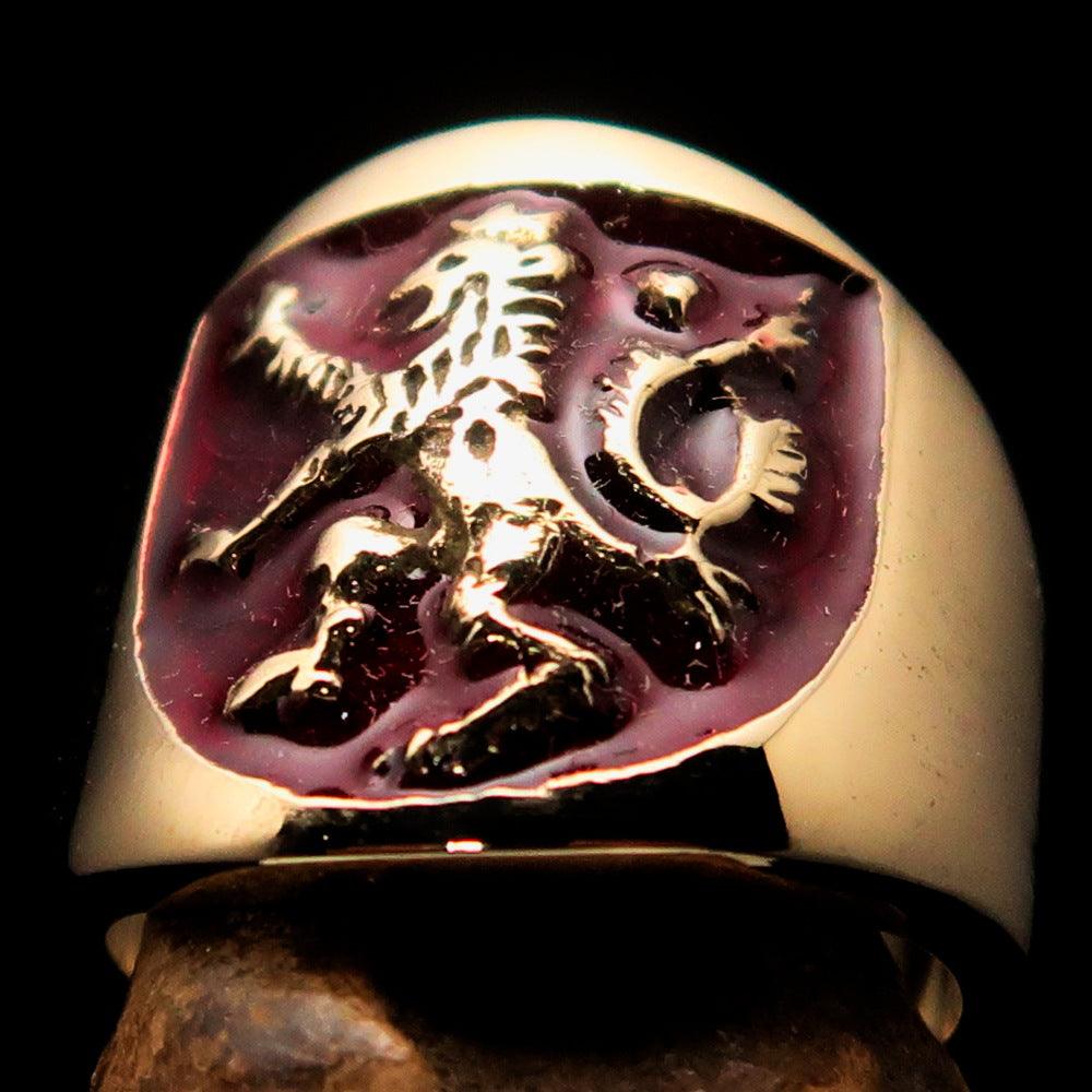 A beautifully crafted ancient men's ring featuring a red enamel rampant lion design, made from solid brass with a polished finish.