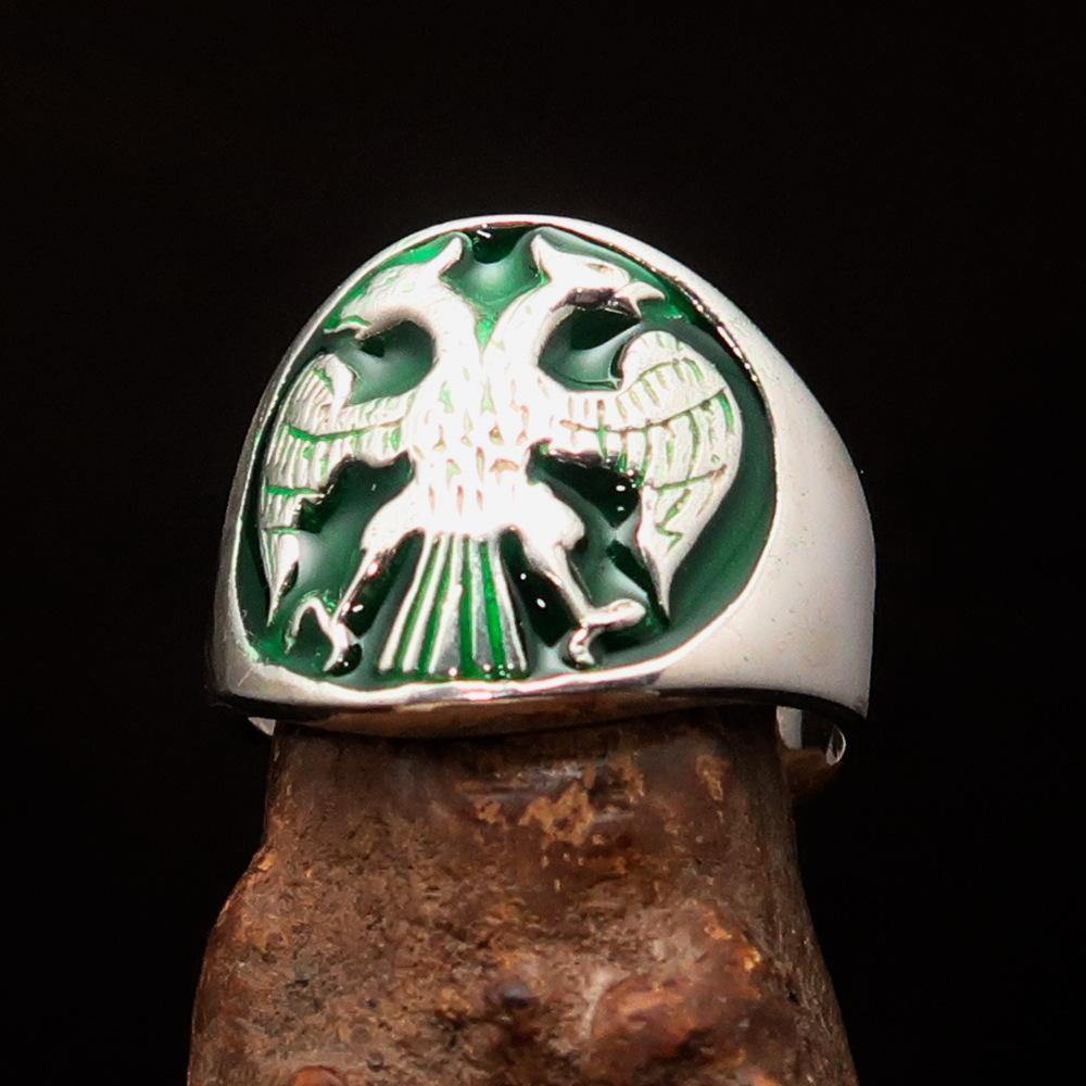 Men's Twin Head Eagle Ring in Sterling Silver with green enamel inlay, showcasing intricate ancient design and polished finish.