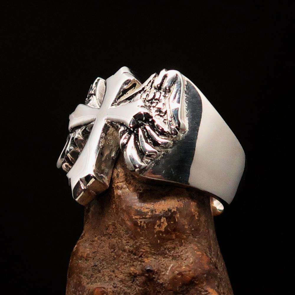 Antiqued sterling silver men's winged cross ring with high polish finish, showcasing intricate details and craftsmanship.