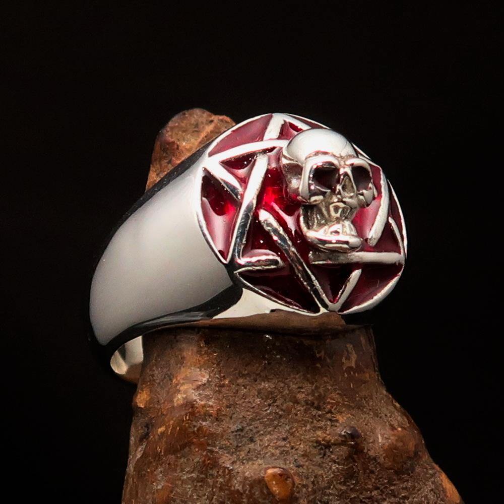 A beautifully crafted domed red Men's Hexagram Skull Ring made of solid sterling silver with a high-polished finish and red enamel.