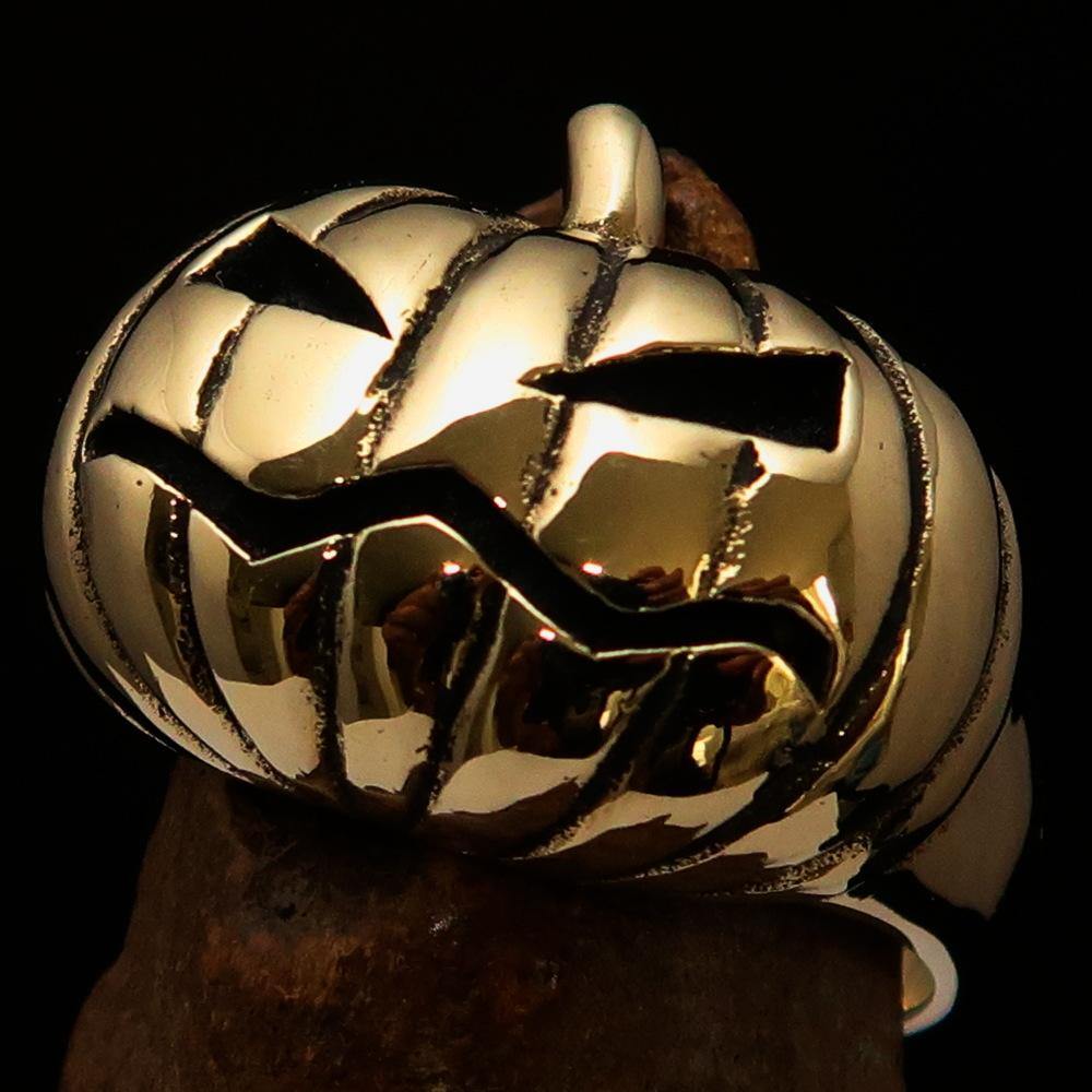 A beautifully crafted solid brass men's pumpkin ring with an antiqued and polished finish, showcasing intricate pumpkin design.