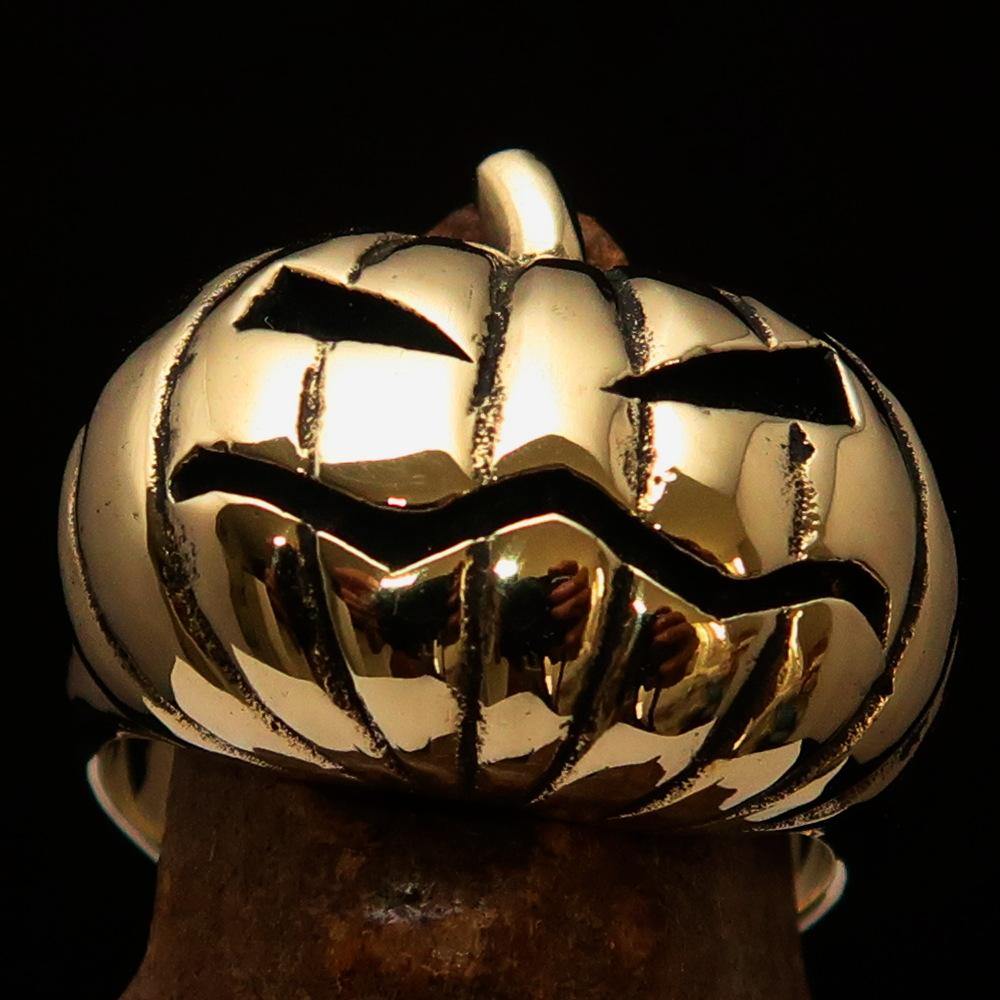 A beautifully crafted solid brass men's pumpkin ring with an antiqued and polished finish, showcasing intricate pumpkin design.