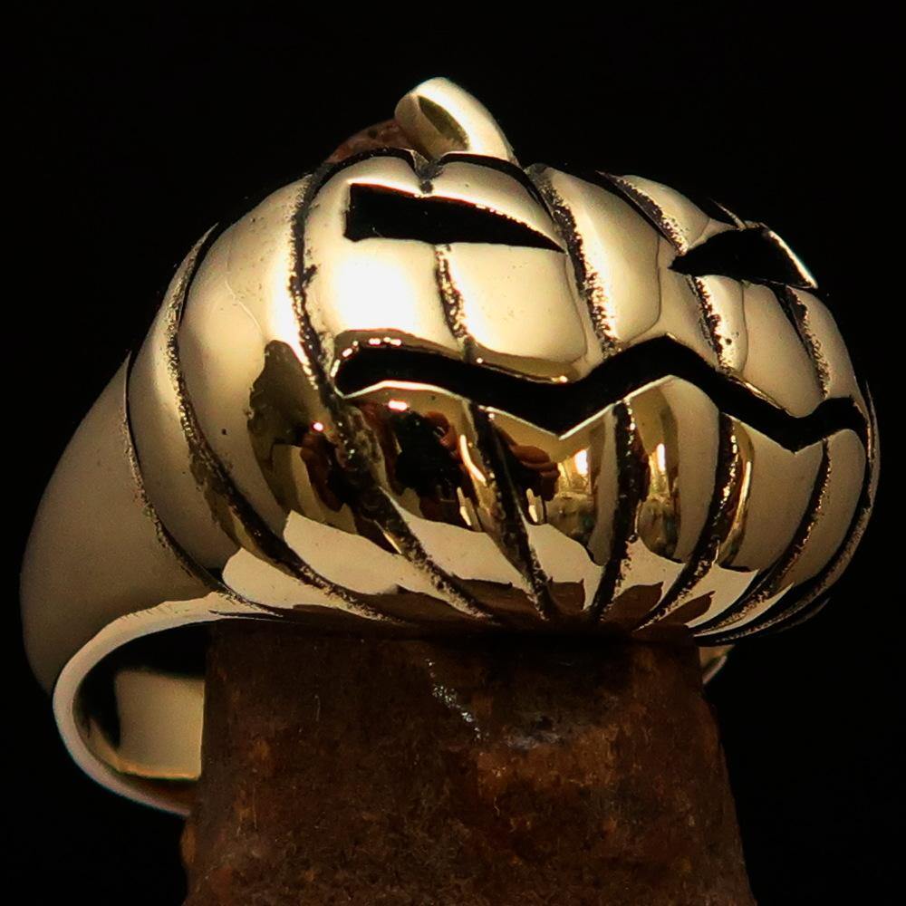 A beautifully crafted solid brass men's pumpkin ring with an antiqued and polished finish, showcasing intricate pumpkin design.